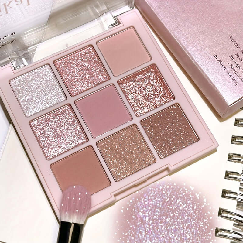 Cherry Blossom Eyeshadow Palette showing 9 shades of glitter and matte colors for versatile makeup looks.