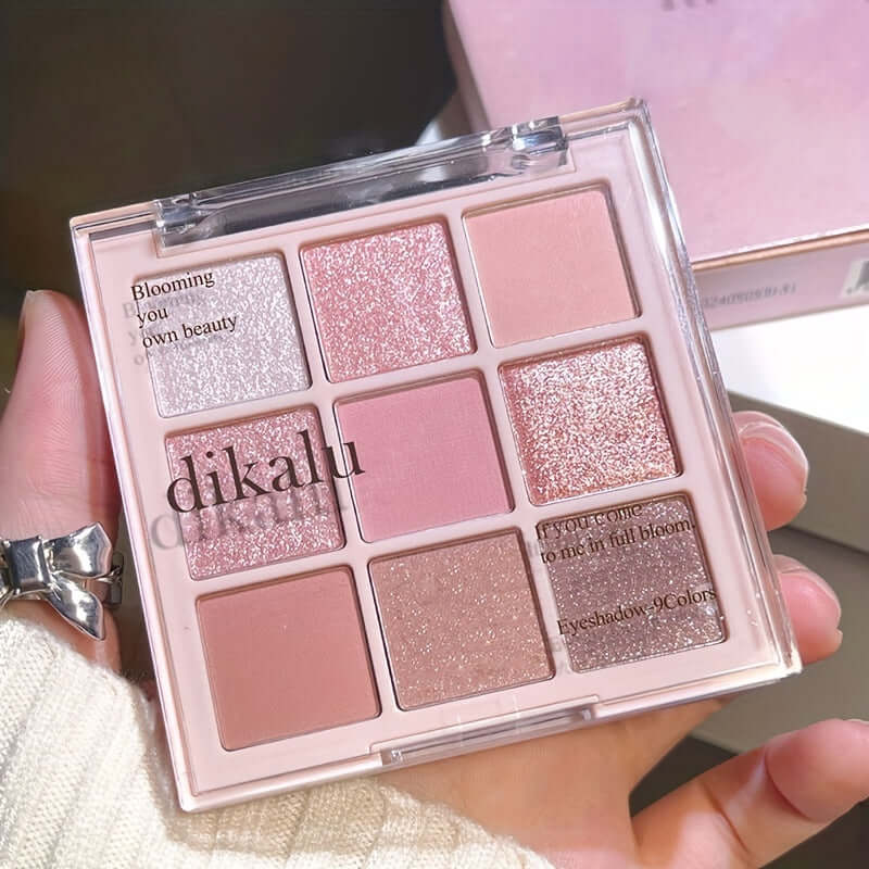 Cherry Blossom Eyeshadow Palette showing 9 shades of glitter and matte colors for versatile makeup looks.